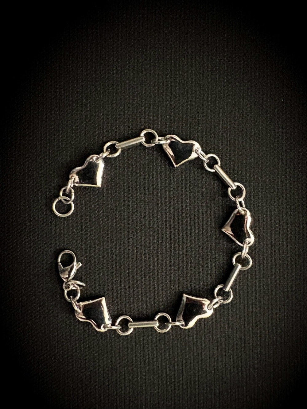 Silver heart link bracelet.